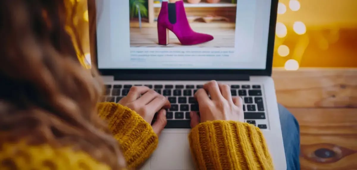 person-using-laptop-view-vivid-pink-highheeled-boot-representing-convenience-style-online-shopping-fashionable-footwear